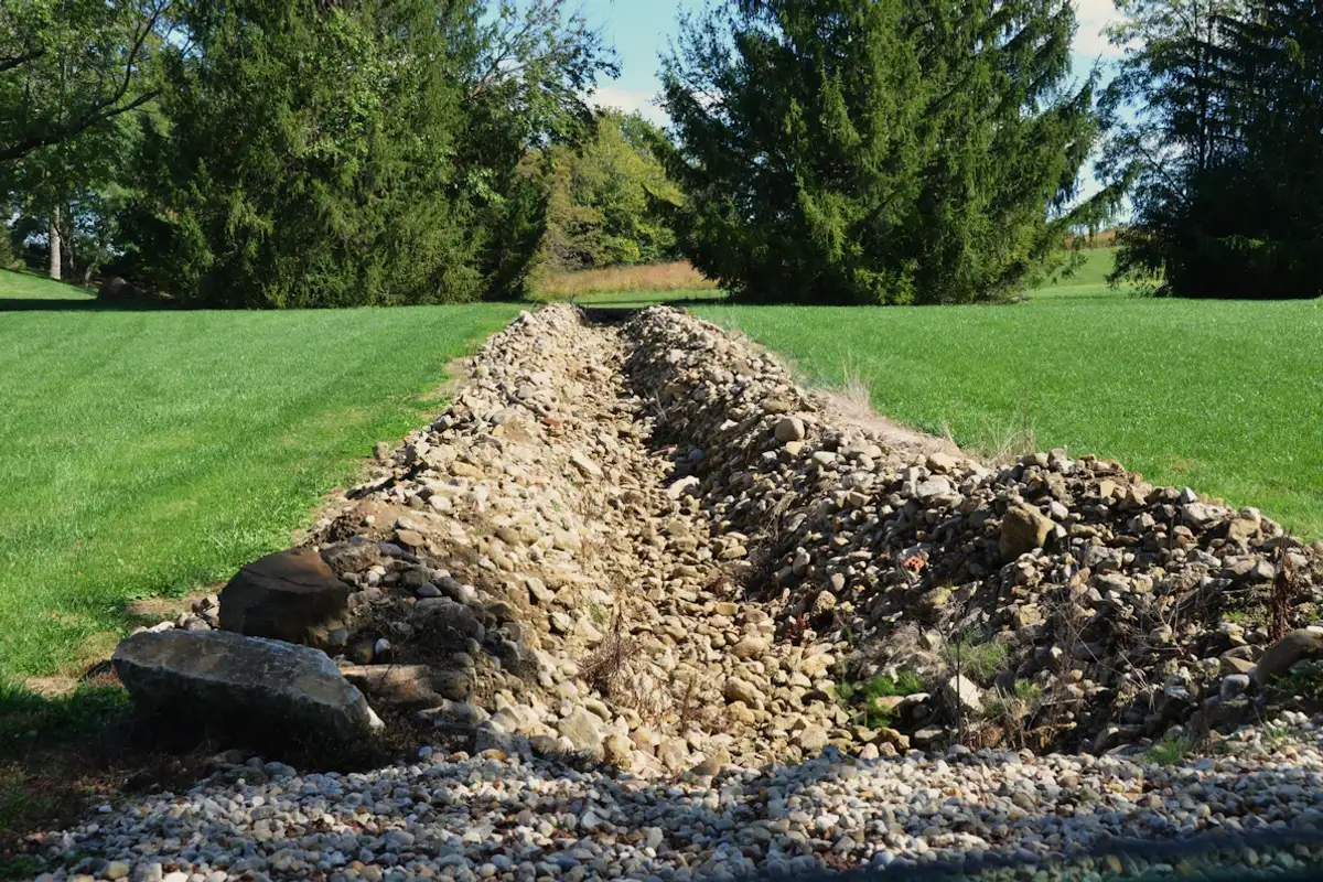 French drain gravel trench installation in Lavon TX yard